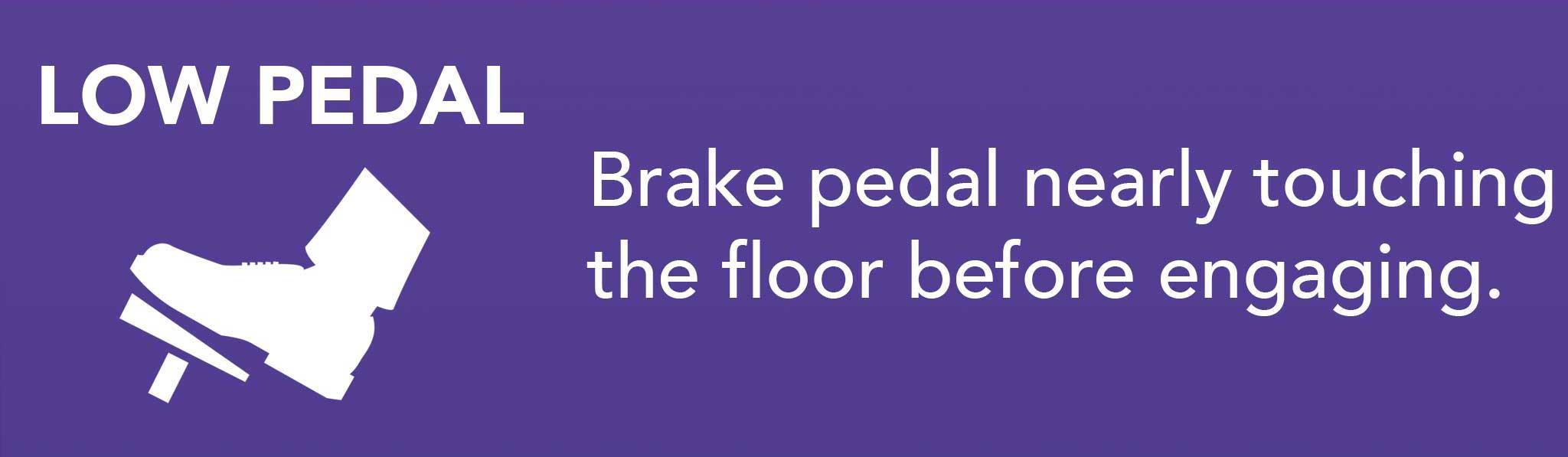 Brake pedal nearly touching the floor before engaging.